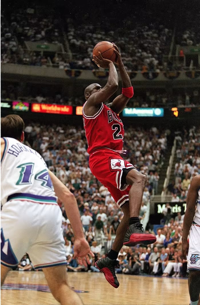 Michael Jordan wearing the Air Jordan 12 Flu Game in the NBA Finals Game 5 vs. the Utah Jazz